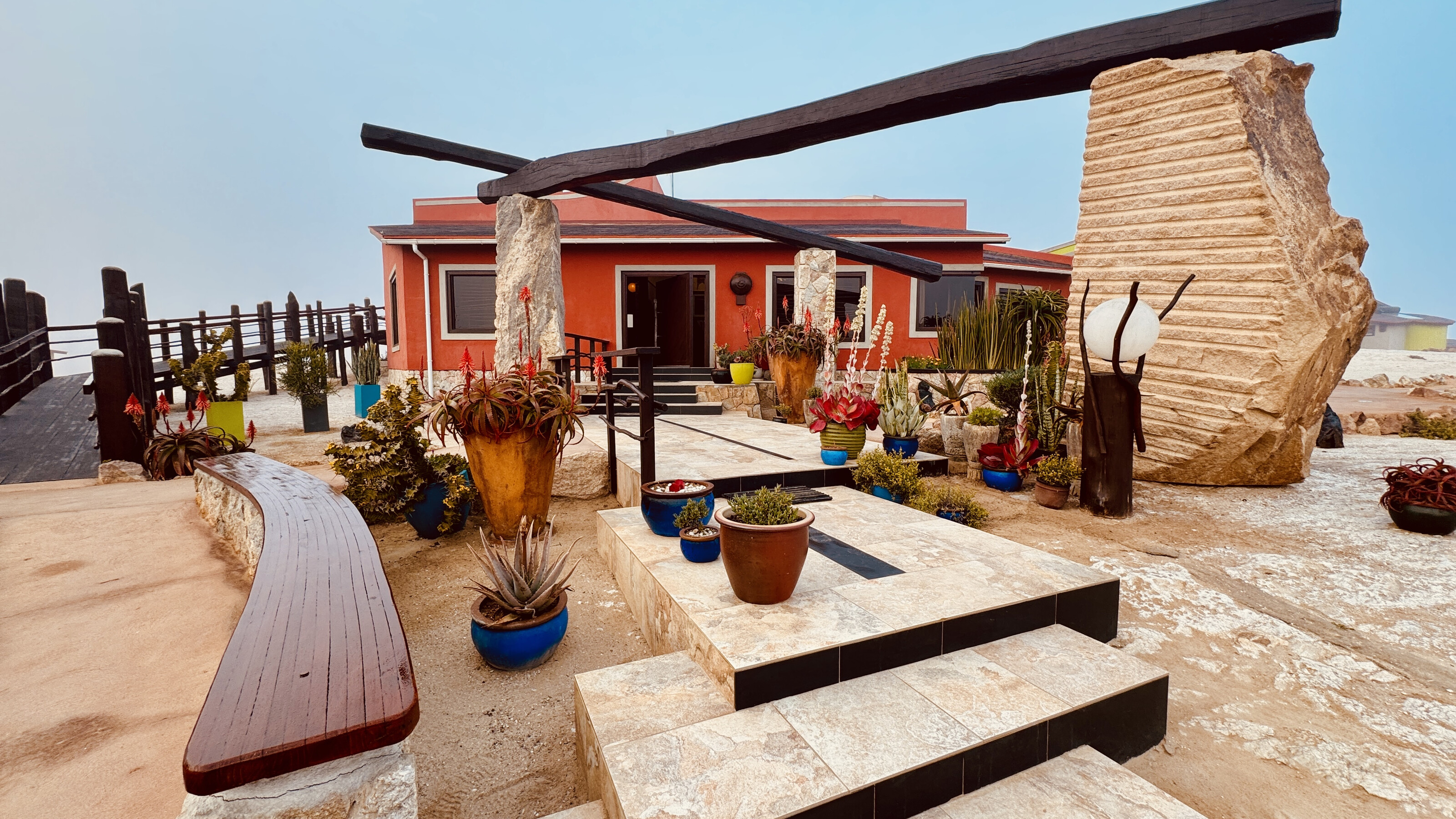 Desert Breeze lodge entrance, stone sculpture and garden