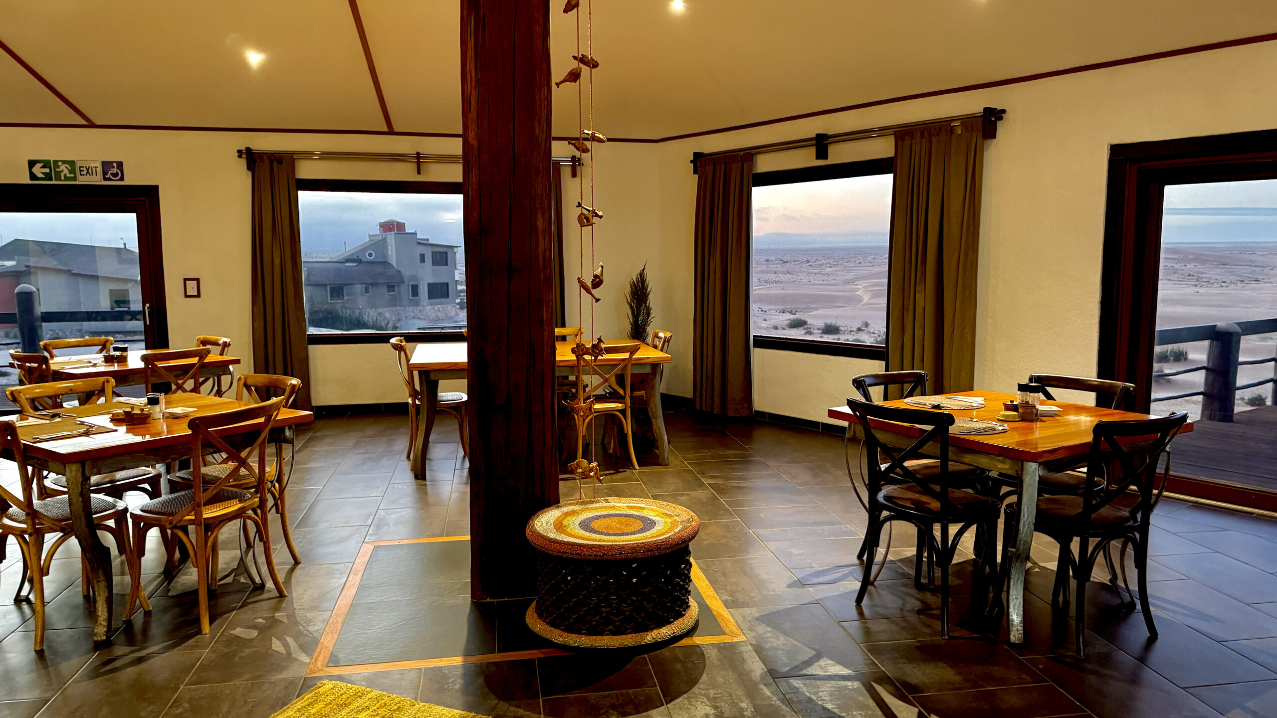 Desert Breeze dining room with timber pillar and views over the dunes