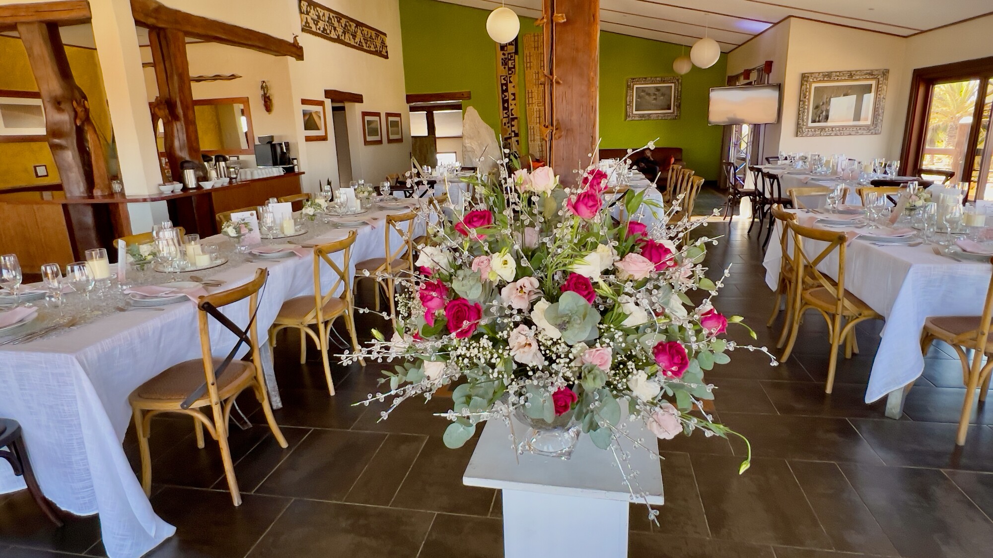 Pink and white flowers beside a celebration table
