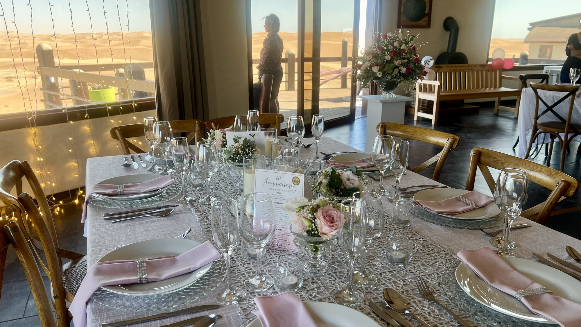 Celebration table with flowers and glassware in the dining room