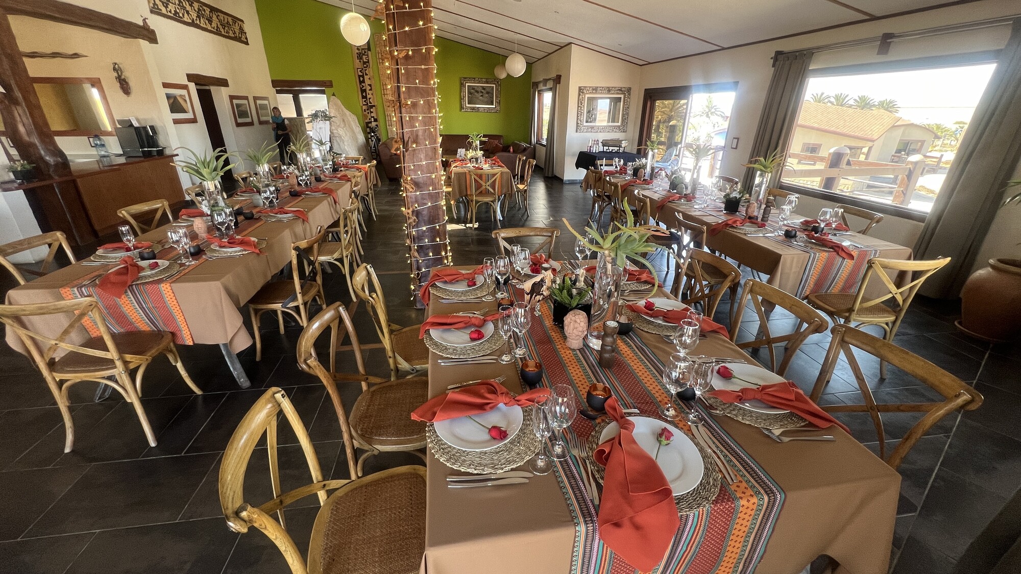 Dining room prepared for an event with patterned table runners