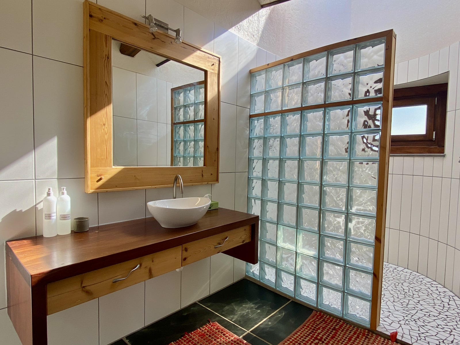Desert Breeze en-suite bathroom with glass-block shower
