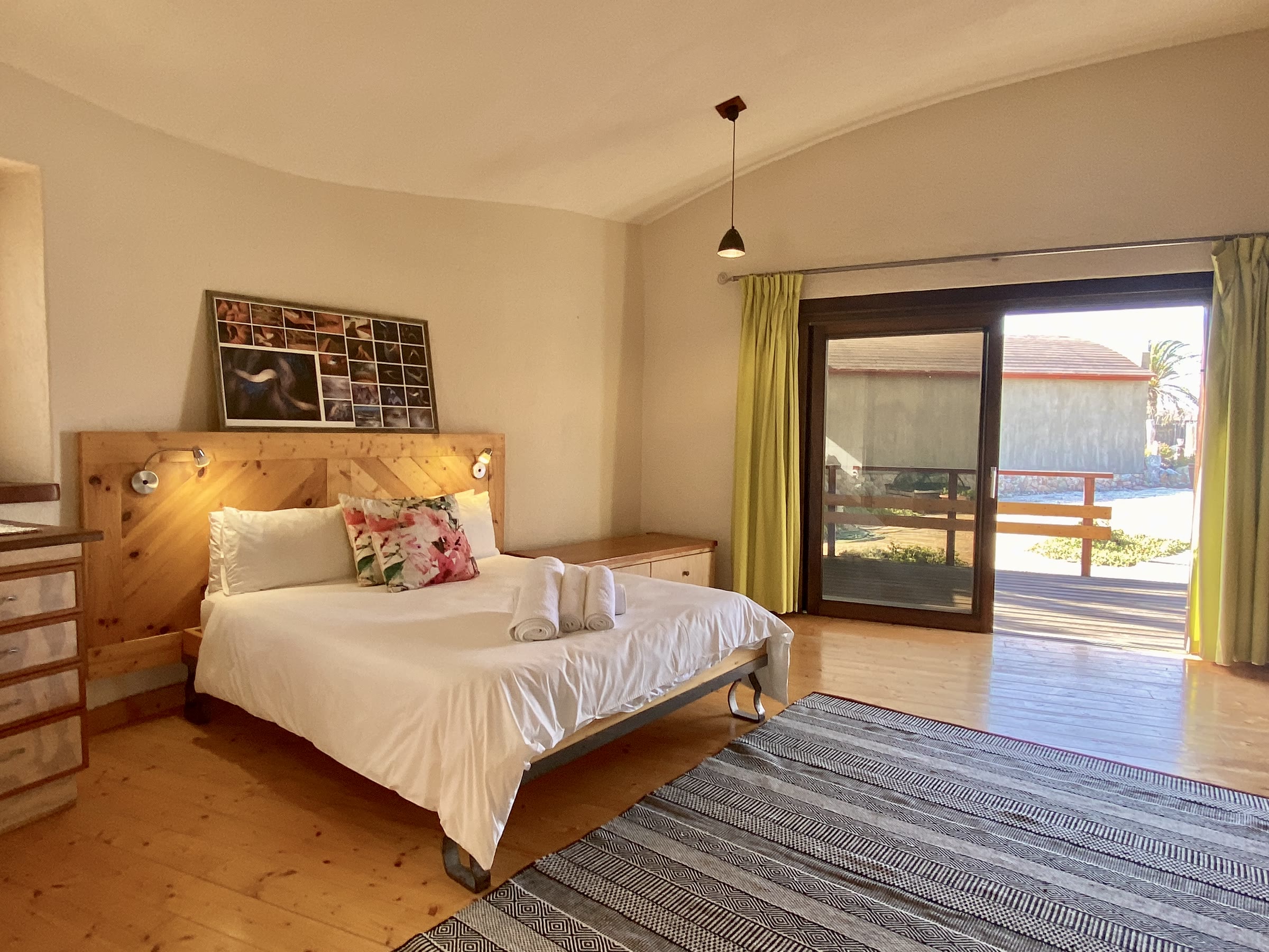 Desert Breeze bedroom opening onto a garden-facing deck